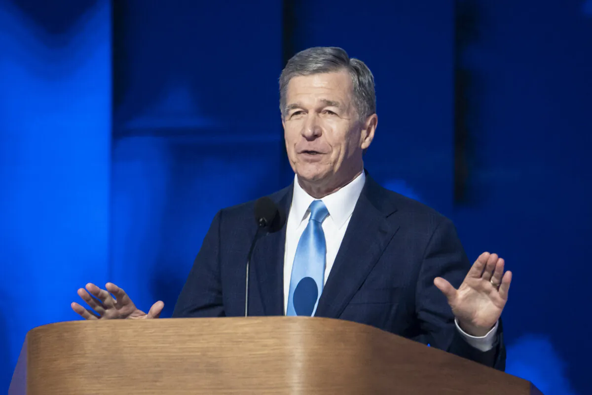 Then-North Carolina Gov. Roy Cooper speaks during the last day of the Democratic National Convention in Chicago on Aug. 22, 2024. (Madalina Vasiliu/The Epoch Times)