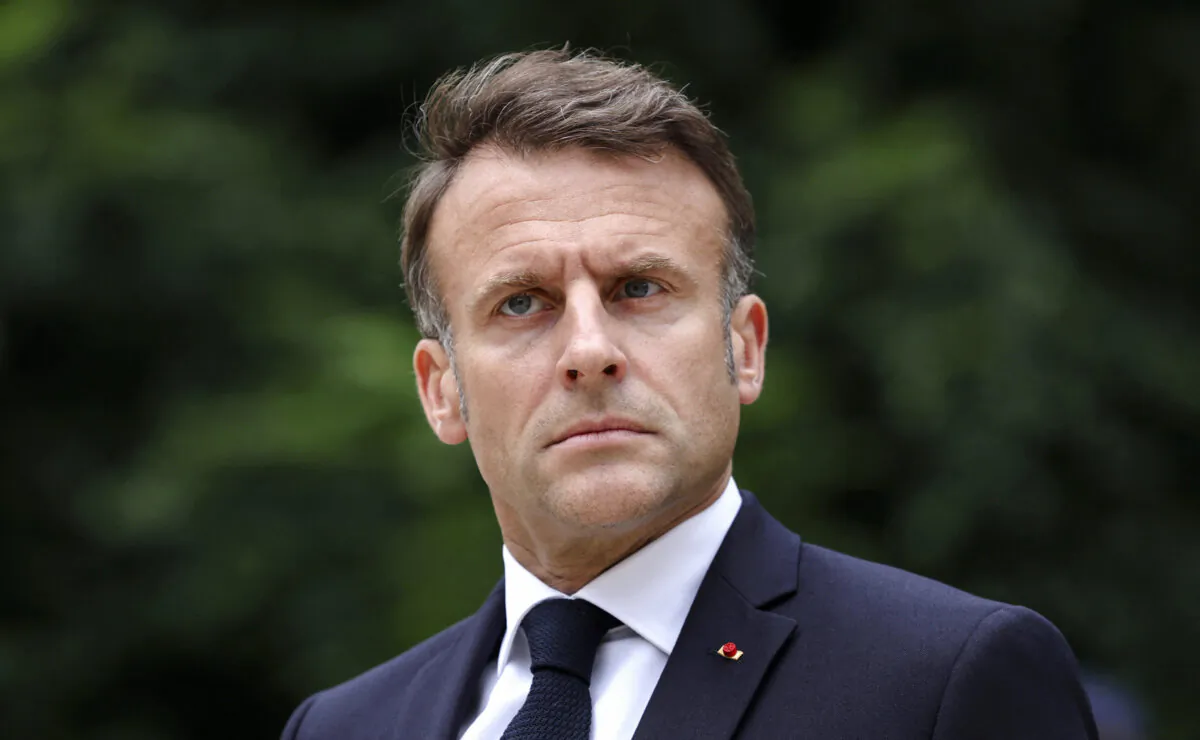 France's President Emmanuel Macron reviews troops that took part in the July 14 Bastille Day parade in Paris on July 2, 2024. (Aurelien Morissard/ Pool/AFP)