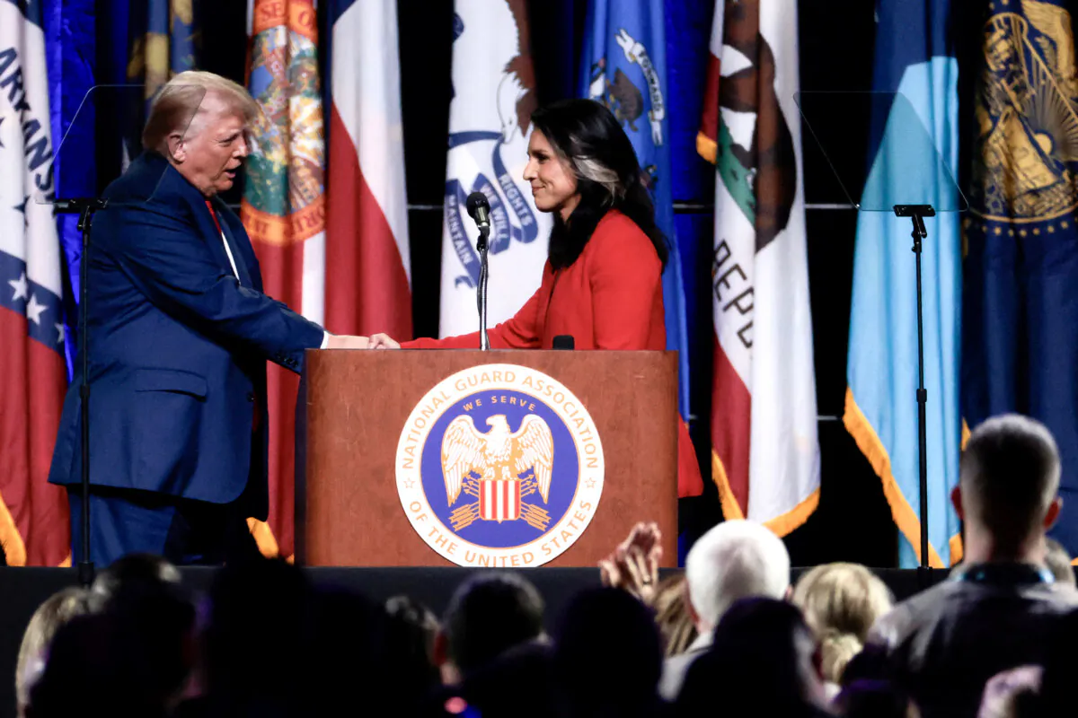 Former President Donald Trump (L) shakes hands with former Rep. Tulsi Gabbard after she endorsed him at the National Guard Association Conference in Detroit on Aug. 26, 2024. (Jeff Kowalsky/AFP via Getty Images)