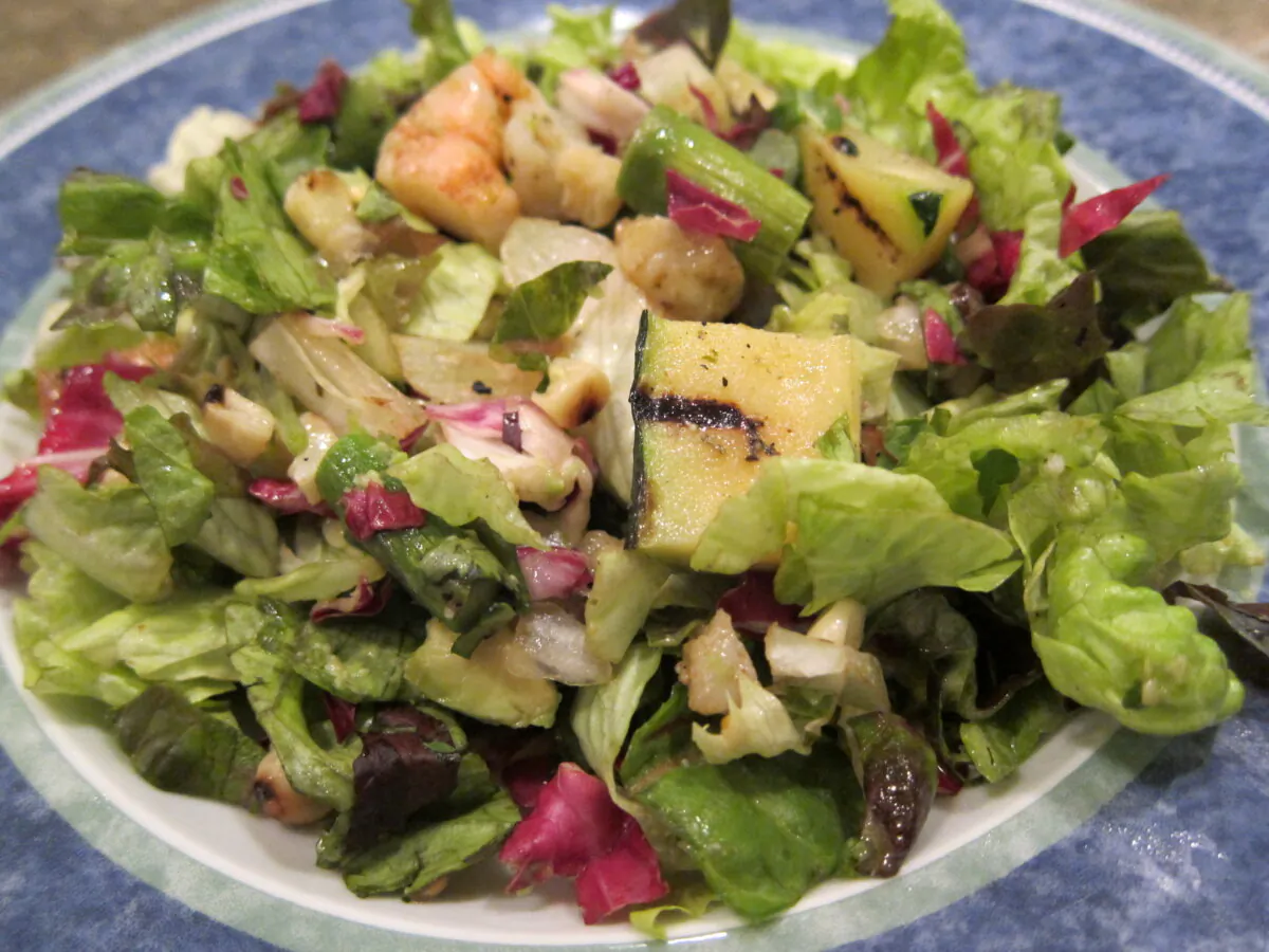 The vibrant colors of the grilled shrimp, asparagus, scallions, corn and fresh lettuce are beautiful. (Diane Rossen Worthington/TNS)