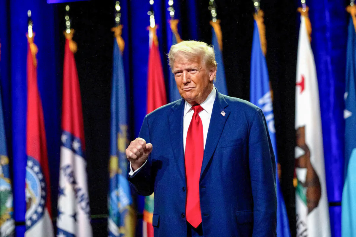 Former President Donald Trump raises his fist as he greets the crowd before speaking during the National Guard Association of the United States' 146th General Conference & Exhibition at Huntington Place Convention Center in Detroit, Mich., on Aug. 26, 2024. (Emily Elconin/Getty Images)