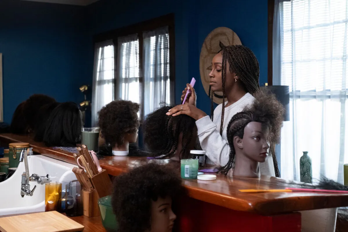 Melony Armstrong (Simona Brown) practices her braiding skills, in “Freedom Hair.” (MPI)