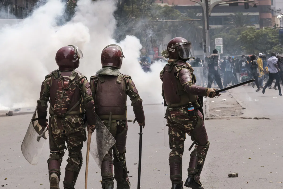 Kenyan anti-riot police officers are seen during an anti-government demonstration following nationwide deadly protests over tax hikes and a controversial now-withdrawn tax bill in downtown Nairobi, Kenya, on July 2, 2024. (Kabir Dhanji/AFP via Getty Images)