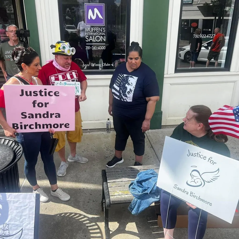 Melissa Berry (C) talks with supporters during a recent gathering in support of a deeper investigation into the unattended death of Sandra Birchmore of Canton, Mass., on Feb. 4, 2021. (Courtesy of JusticeForSandraBirchmore.com)