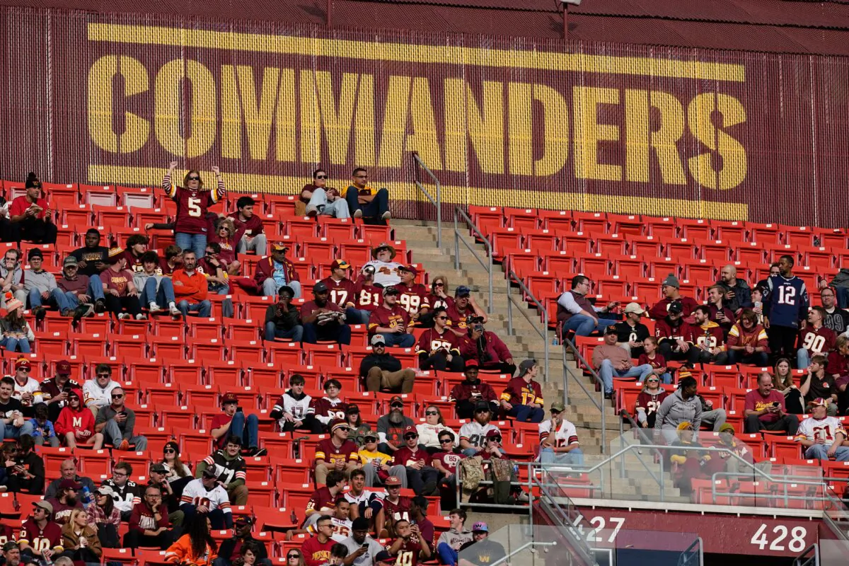 Fans watch the second half of an NFL football game between the Cleveland Browns and the Washington Commanders at FedEx Field in Landover, Md., on Jan. 1, 2023. (Patrick Semansky/AP Photo)
