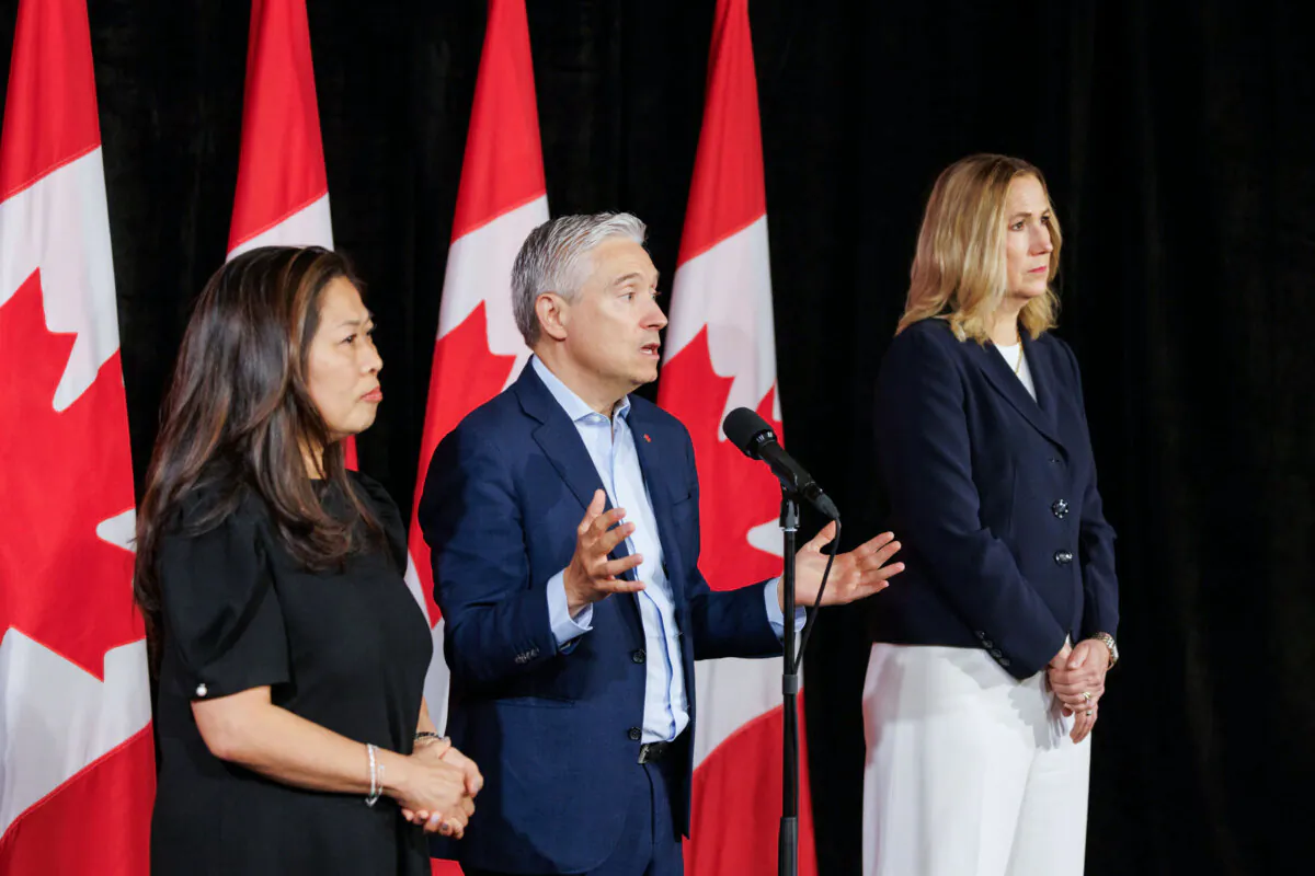 Industry Minister Francois-Philippe Champagne (C), International Trade Minister Mary Ng (L), and Canada's Ambassador to the U.S. Kirsten Hillman speak to media at the federal cabinet retreat in Halifax on Aug. 27, 2024. (Kelly Clark/The Canadian Press)