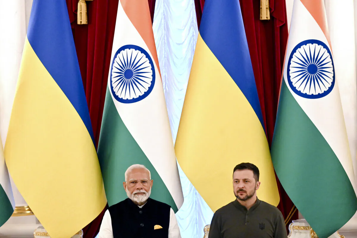 Ukrainian President Volodymyr Zelenskyy (R) and Indian Prime Minister Narendra Modi attend a document signing after their talks in Mariinskyi Palace in Kyiv, on Aug. 23, 2024. (Sergei Supinsky/AFP via Getty Images)