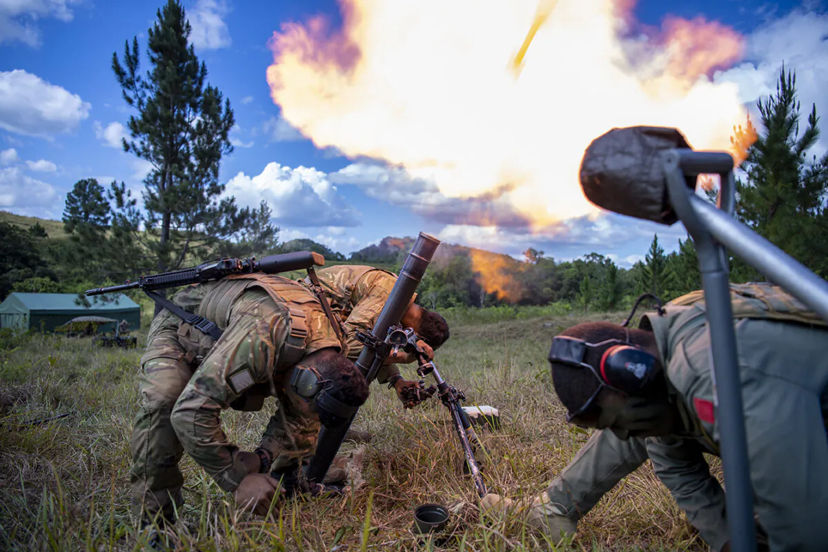 Mortar Firing during Ex Cartwheel in Fiji.
The tactical field training exercise, Exercise CARTWHEEL, was a US and Fiji-led multinational exercise conducted in the Nausori Highlands in Fiji. The exercise involved defence personnel from the Republic of Fiji Military Forces (RFMF), United States Army Pacific (USARPAC), British Army and Australian Defence Force (ADF).
55 combat soldiers from 1st (NZ) Brigade in Linton and Burnham participated in the Exercise to enhance capability in both urban and jungle environments. Training also included demonstrations of sustained fire machine guns, section attacks and ambushes, reacting to enemy indirect firing and ethical decision-making scenarios. A light infantry Platoon from Delta Company, 2/1 RNZIR also conducted reconnaissance operations, section and platoon harbours drills, survival and tracking training.