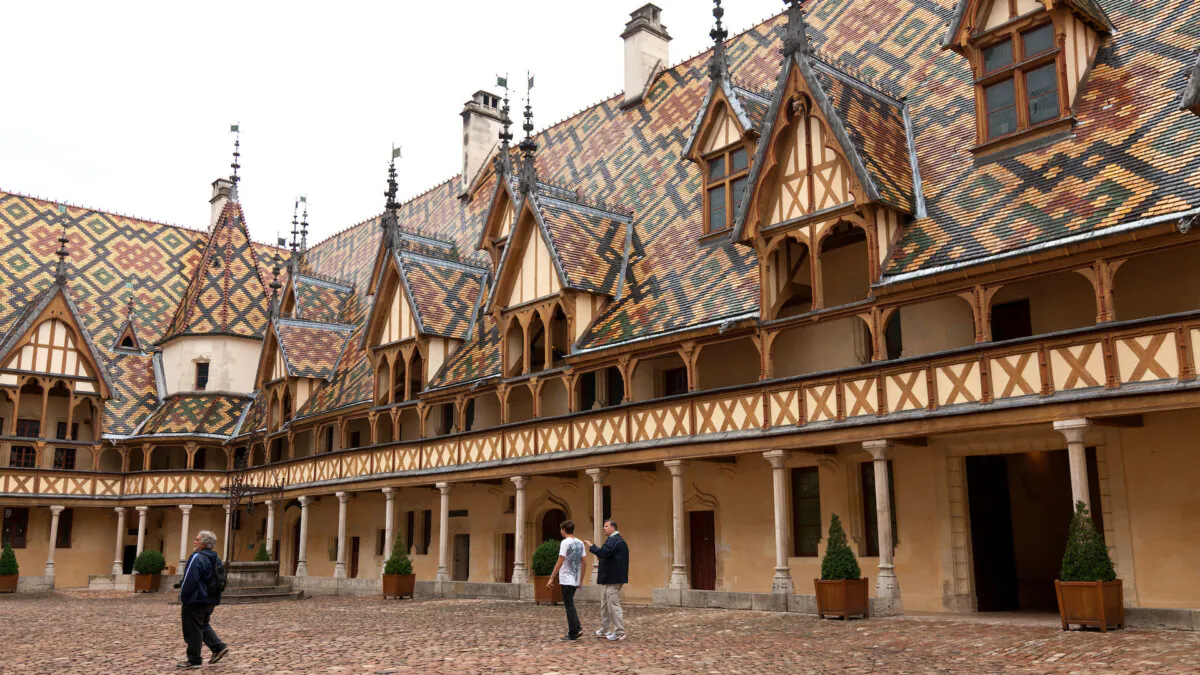 The geometrically patterned tiles decorating the steep roofs of the Hôtel Dieu des Hospices de Beaune are an art form in themselves. (Dominic Arizona Bonuccelli, Rick Steves’ Europe)