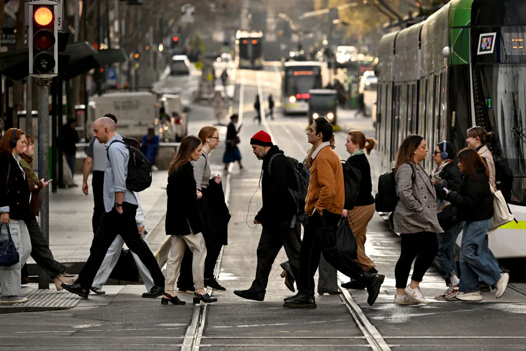 People cross a street in Melbourne's central business district in Melbourne, Australia, on Aug. 14, 2024. (William West/AFP via Getty Images)