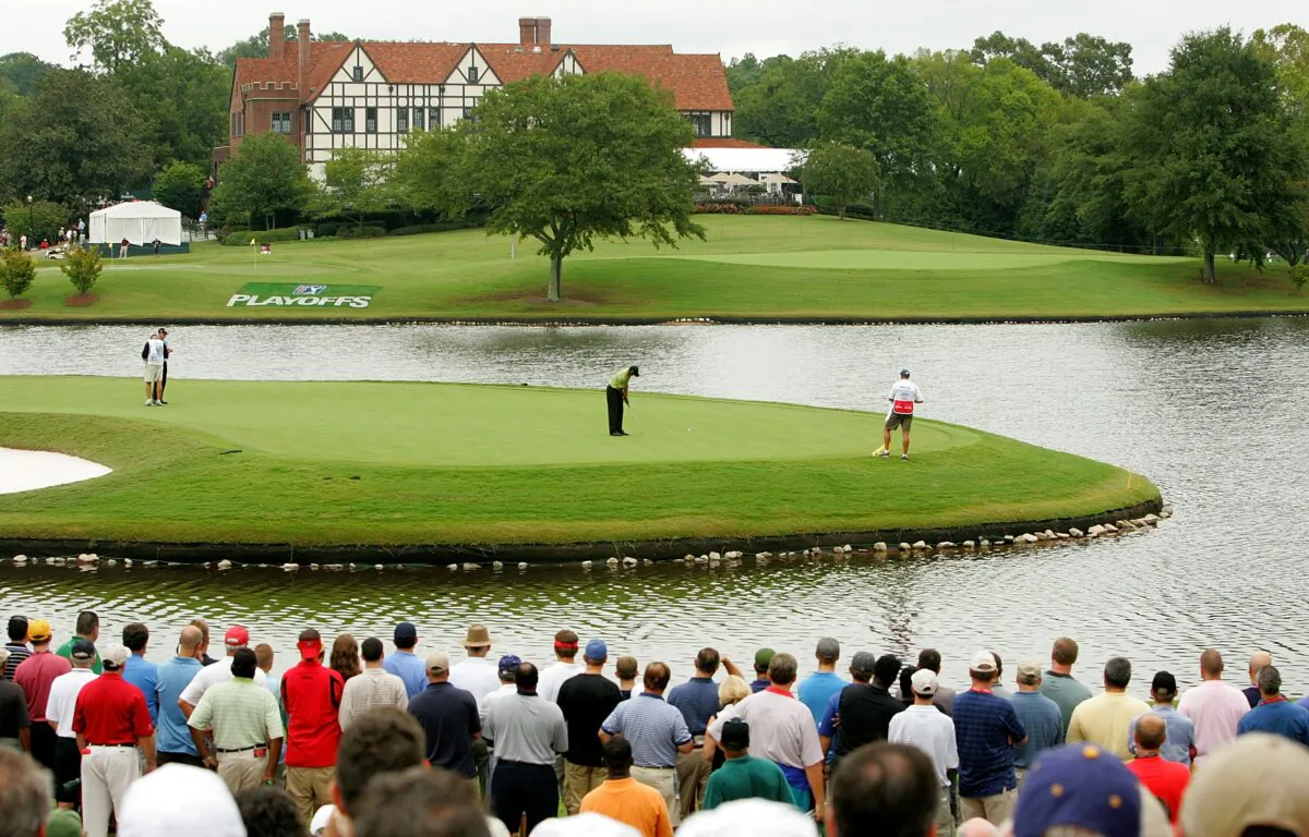 Tiger Woods makes a birdie putt on the 6th hole during the second round of the TOUR Championship, the final event of the new PGA TOUR Playoffs for the FedExCup at East Lake Golf Club in Atlanta, Georgia on September 14, 2007. (Streeter Lecka/Getty Images)