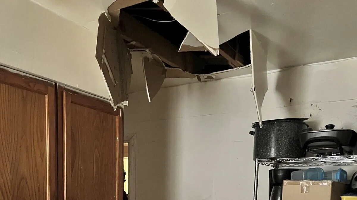Debris covering the ground of a  private home after fugitive Deario Wilkerson was captured by U.S. Marshals after trying to hide in the attic and fell through the ceiling, in Memphis on Aug. 26, 2024. (U.S. Marshals via AP)