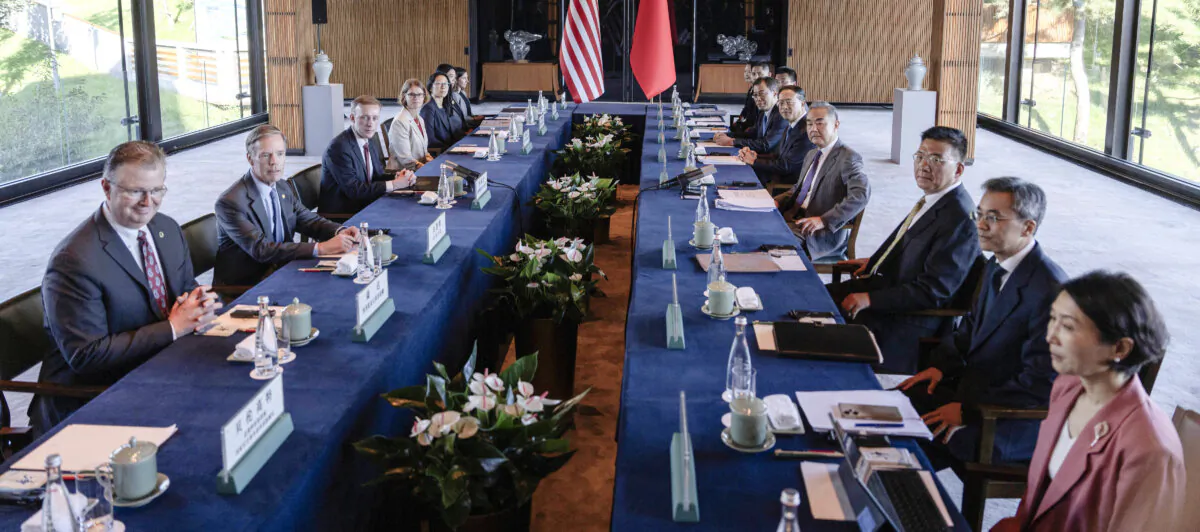 Chinese Foreign Minister Wang Yi (4th R) and U.S. national security adviser Jake Sullivan (3rd L) pose for photos before talks at Yanqi Lake in Beijing on Aug. 27, 2024. (Ng Han Guan/Pool/AFP via Getty Images)