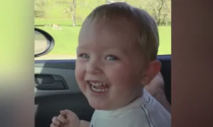 Toddler Laughs at Ostrich Eating