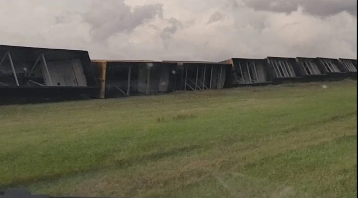 Railroad cars are knocked off the tracks due to high winds Wednesday night, near Steele, N.D., on Thursday, Aug. 29, 2024.  (Rebecca Neustel via AP)
