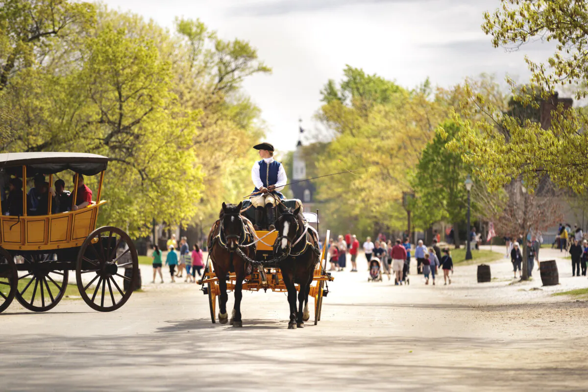 A carriage drives along Duke of Gloucester Street on a spring day in Colonial Williamsburg’s Historic Area. The Capitol can be seen at the end of the street. (Darnell Vennie/The Colonial Williamsburg Foundation/TNS)