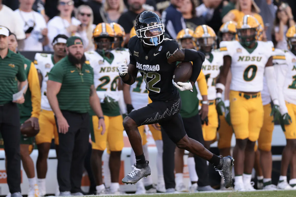 Travis Hunter (12) of the Colorado Buffaloes runs with the ball for a touchdown during the first quarter against the North Dakota State Bison at Folsom Field in Boulder, Colo., on Aug. 29, 2024. (Andrew Wevers/Getty Images)
