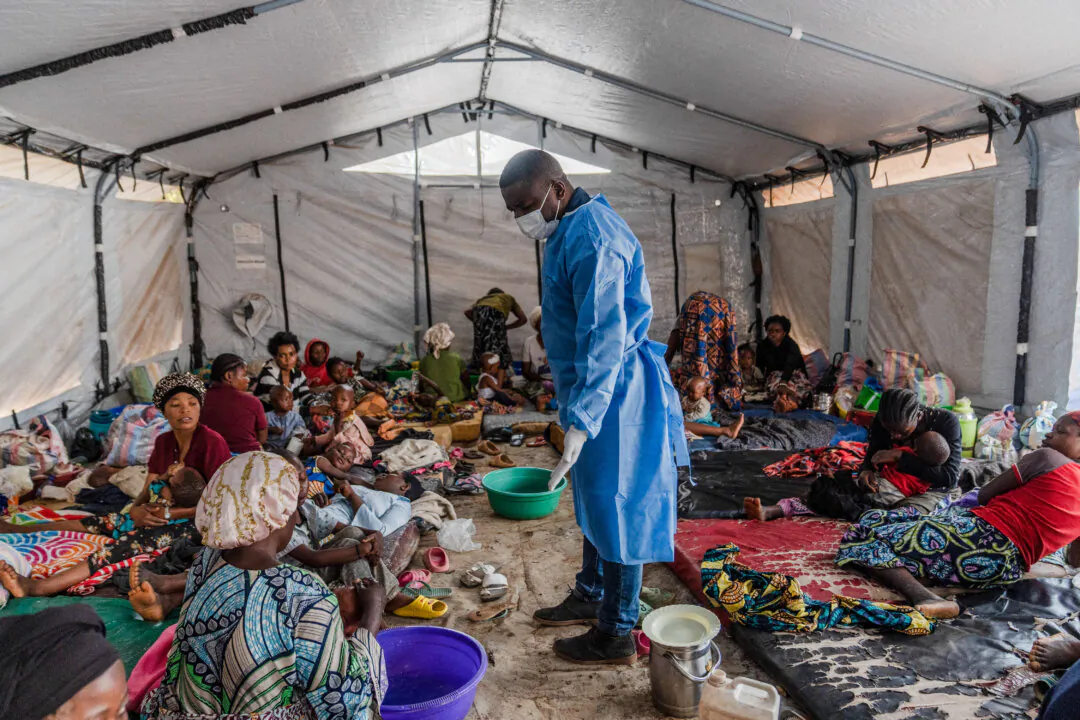A doctor visits patients recovering from mpox in the village of Kavumu, Democratic Republic of Congo, on Aug. 24, 2024. (Glody Murhabazi/AFP via Getty Images)