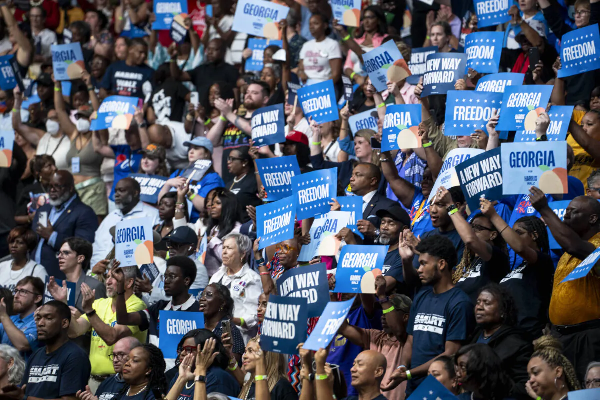 Attendees react to Vice President Kamala Harris's upcoming speech at Enmarket Arena in Savannah, Ga., on Aug. 29, 2024. (Madalina Vasiliu/The Epoch Times)