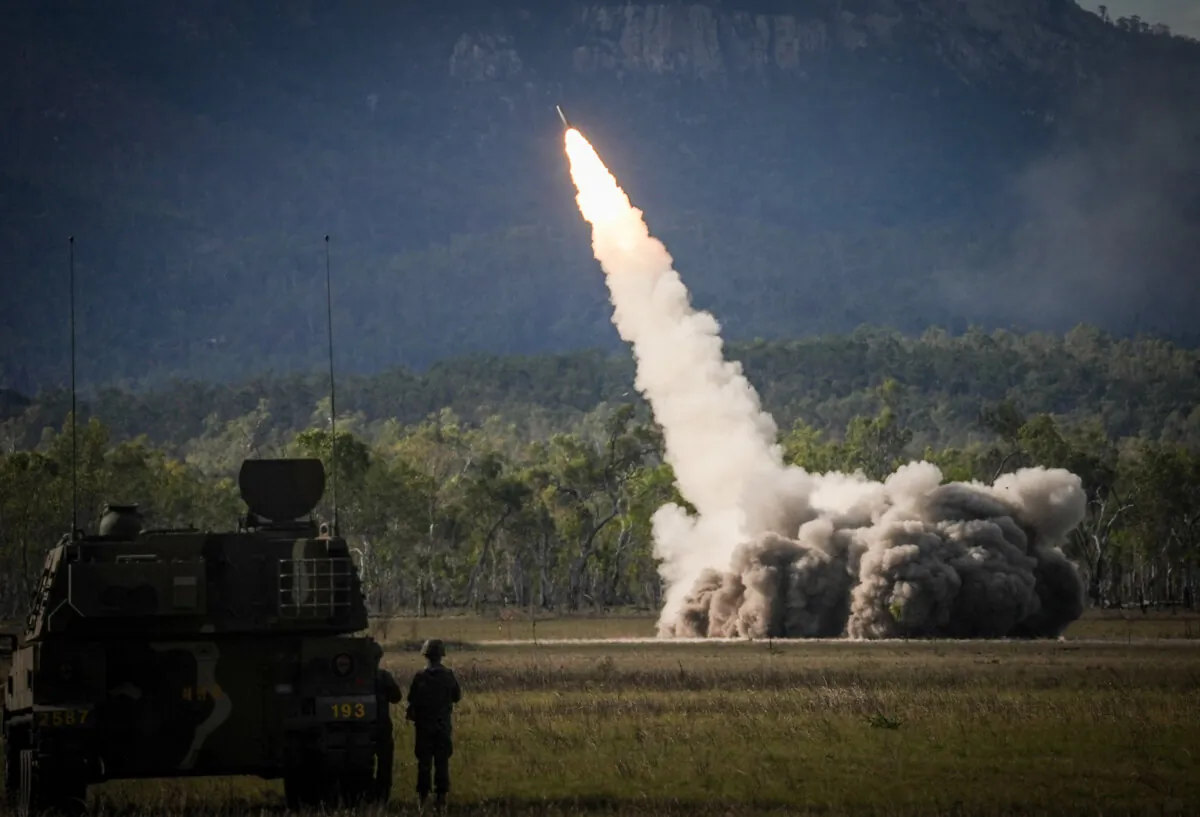 A missile is launched from a United States military HIMARS system during joint military drills at a firing range in northern Australia. (Photo by ANDREW LEESON/AFP via Getty Images)