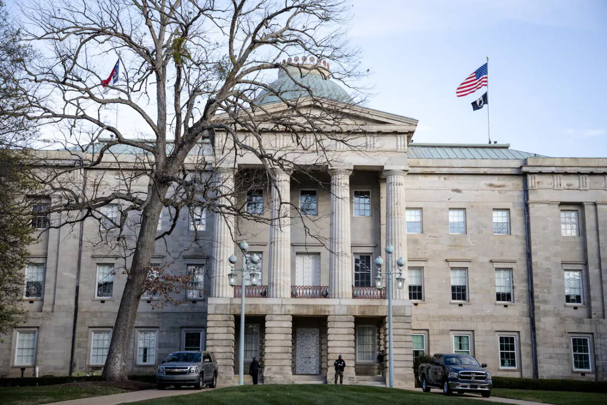 Law enforcement stand guard outside the state Capitol in downtown Raleigh, N.C., on Jan. 17, 2021. (Logan Cyrus/AFP via Getty Images)