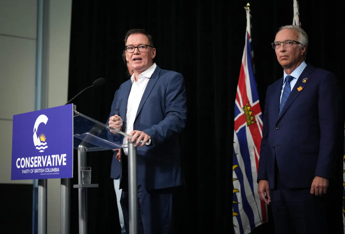 BC United Leader Kevin Falcon (L) speaks as BC Conservative Leader John Rustad listens during a news conference in Vancouver on Aug. 28, 2024. Opposition Leader Kevin Falcon has announced that he is suspending BC United's election campaign and is encouraging supporters to instead back the rival BC Conservative Party. (The Canadian Press/Darryl Dyck)
