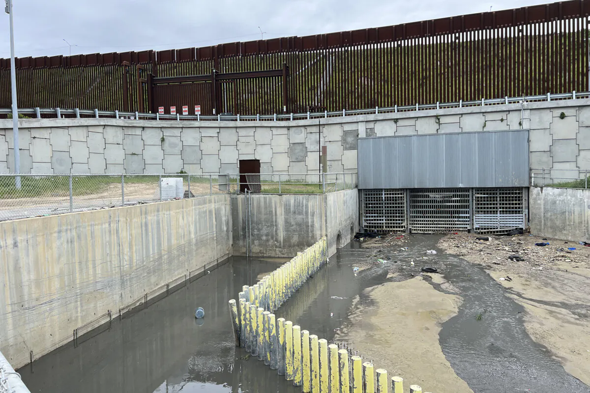 A Canyon Collector at the South Bay International Wastewater Treatment Plant near by the old border fence in San Diego on Mar. 14, 2023. The Canyon Collector operates on rainy days to filter out trash carried by rainwater from Tijuana, Mexico. (Jane Yang/The Epoch Times)