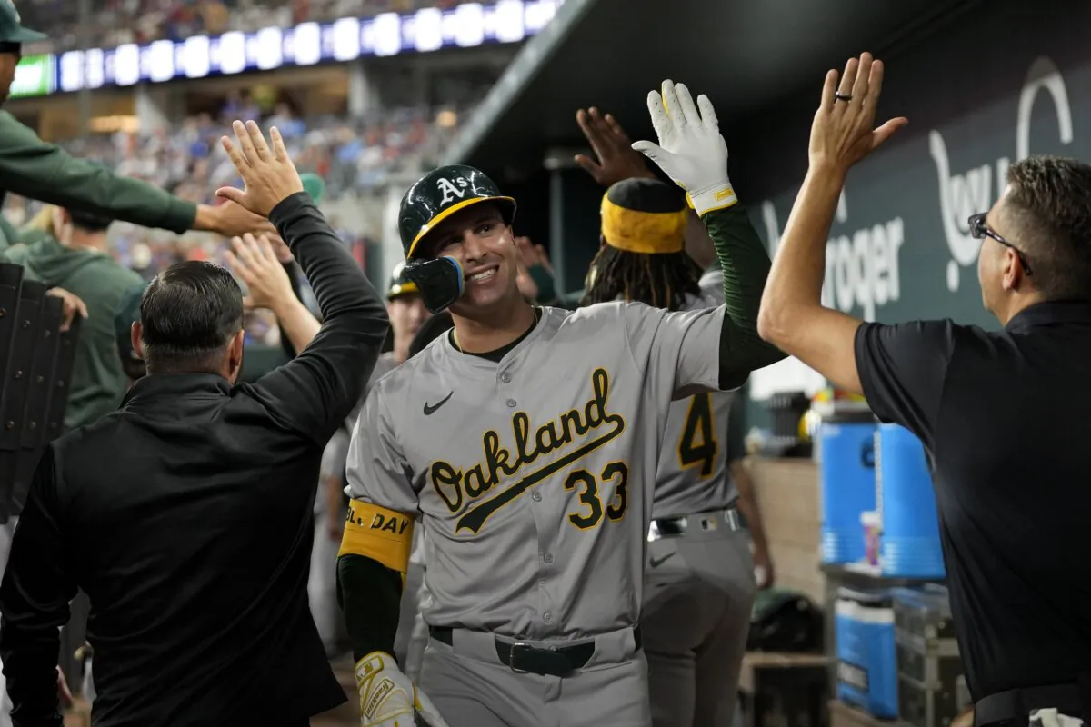 Oakland Athletics' JJ Bleday (33) celebrates his three-run home run against the Texas Rangers in the third inning of a baseball game in Arlington, Texas, on Aug. 30, 2024.. (AP Photo/Tony Gutierrez)