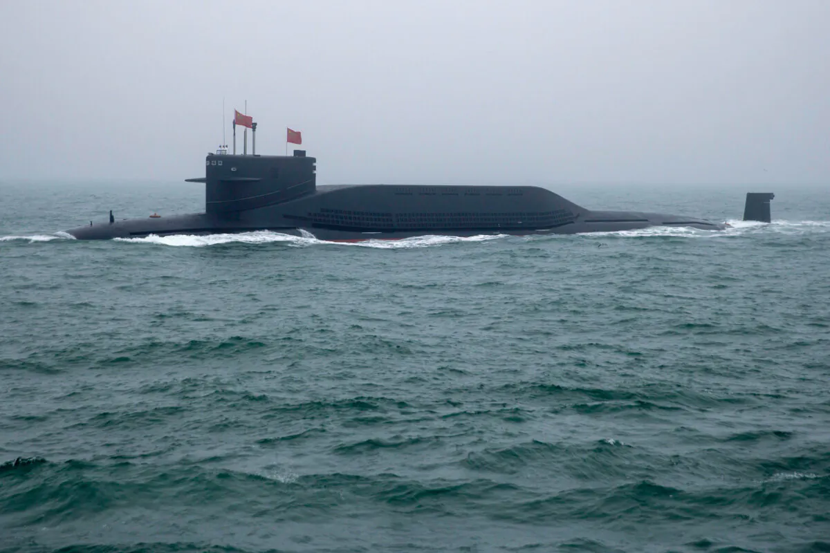 A Chinese Navy nuclear submarine is part of a naval parade in the sea near Qingdao, Shandong Province, China, on April 23, 2019. (Mark Schiefelbein/AFP via Getty Images)