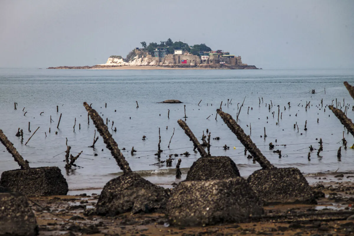 Taiwan's remote Shihyu islet is seen behind the anti-landing spikes on Taiwan's frontline island of Little Kinmen, on Dec. 5, 2023. (Sam Yeh/AFP via Getty Images)