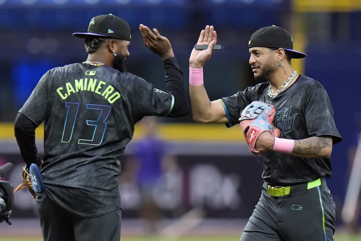 Tampa Bay Rays' Jose Siri celebrates with Junior Caminero (13) after the team defeated the San Diego Padres during a baseball game in St. Petersburg, Fla., on Aug. 31, 2024. (Chris O'Meara/AP Photo)