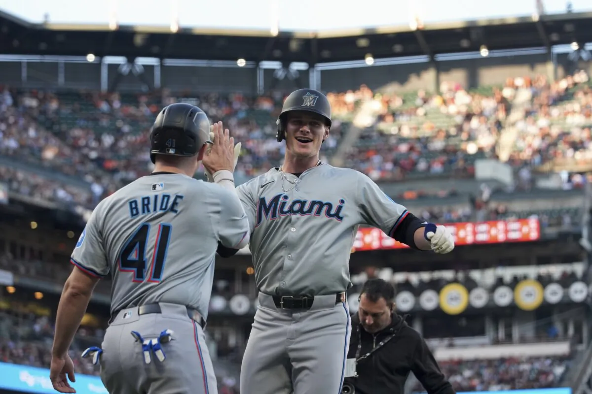 Miami Marlins' Griffin Conine, right, celebrates with Jonah Bride after hitting a two-run home run during the second inning of a baseball game against the San Francisco Giants in San Francisco on Aug. 31, 2024. (Godofredo A. Vásquez/AP Photo)