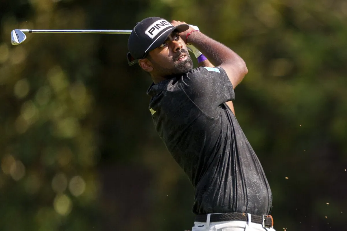 Sahith Theegala hits his second shot from the fairway on the seventh hole during the third round of the Tour Championship golf tournament in Atlanta on Aug. 31, 2024. (Jason Allen/AP Photo)