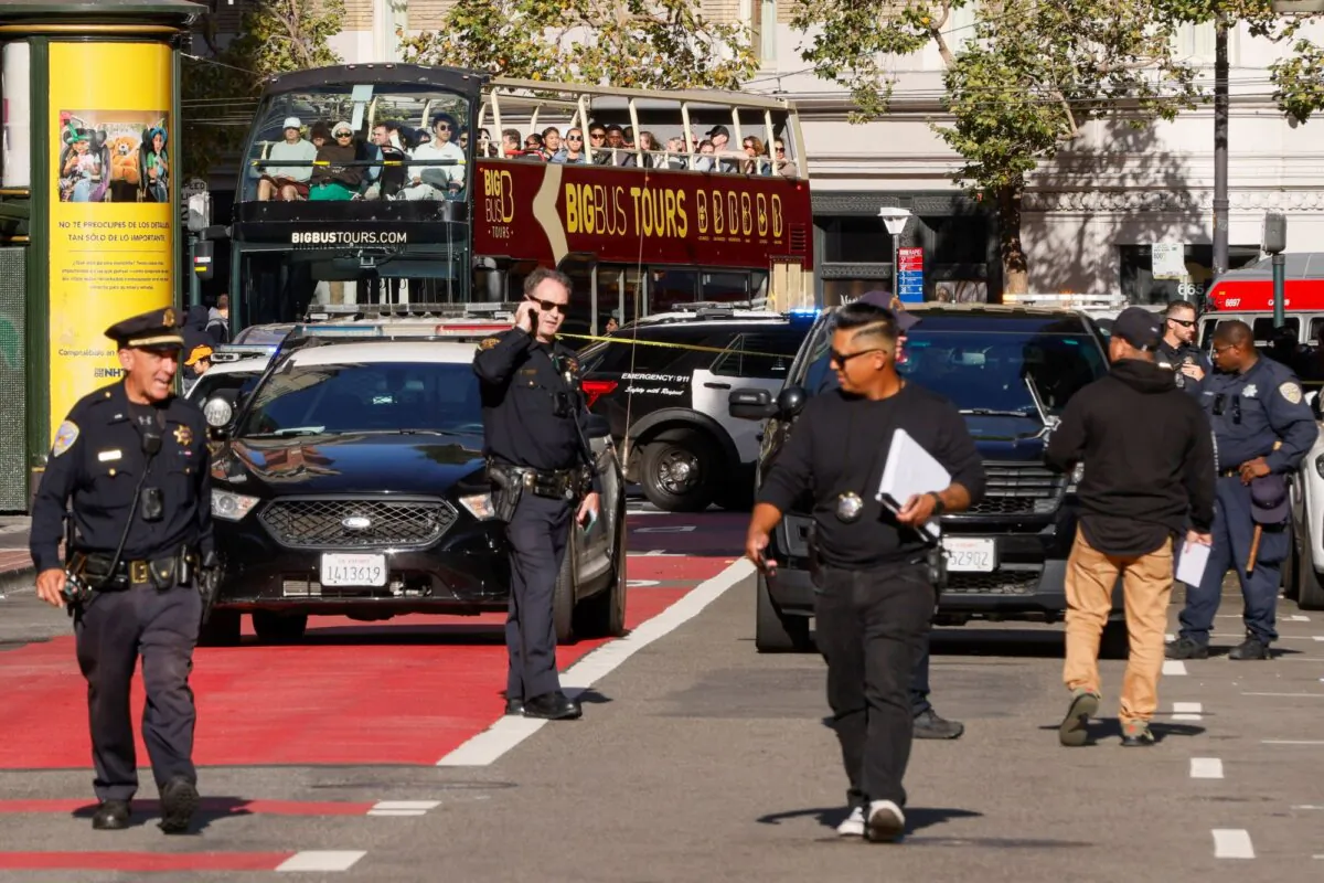 Police officers secure the area and investigate the scene of a shooting involving San Francisco 49ers rookie receiver Rickey Pearsall at Union Square in San Francisco on Aug. 31, 2024. (Santiago Mejia/San Francisco Chronicle via AP)