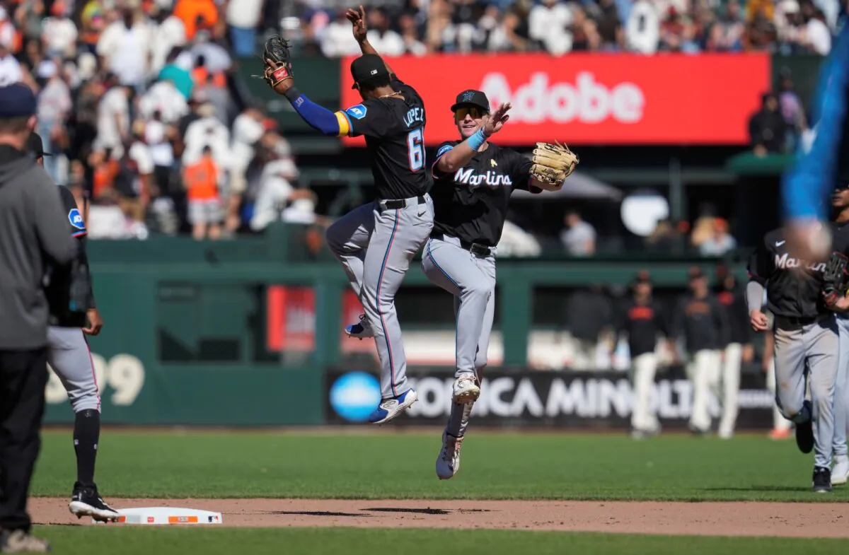 Miami Marlins shortstop Otto Lopez (L) and left fielder Kyle Stowers celebrate a victory over the San Francisco Giants in San Francisco on Sept. 1, 2024. (Godofredo A. Vásquez/AP Photo)