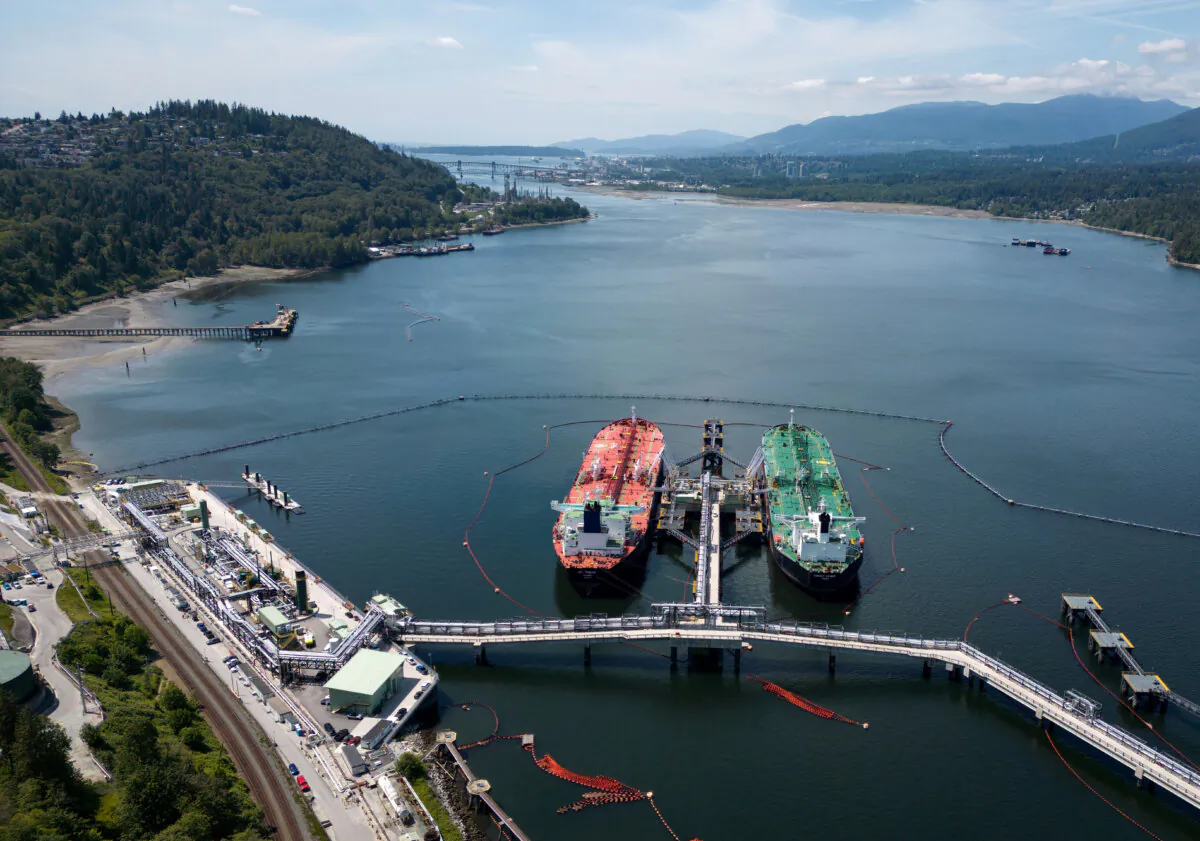 Crude oil tankers are docked at the Trans Mountain Westridge Marine Terminal in Burnaby, B.C., on June 10, 2024. (The Canadian Press/Darryl Dyck)