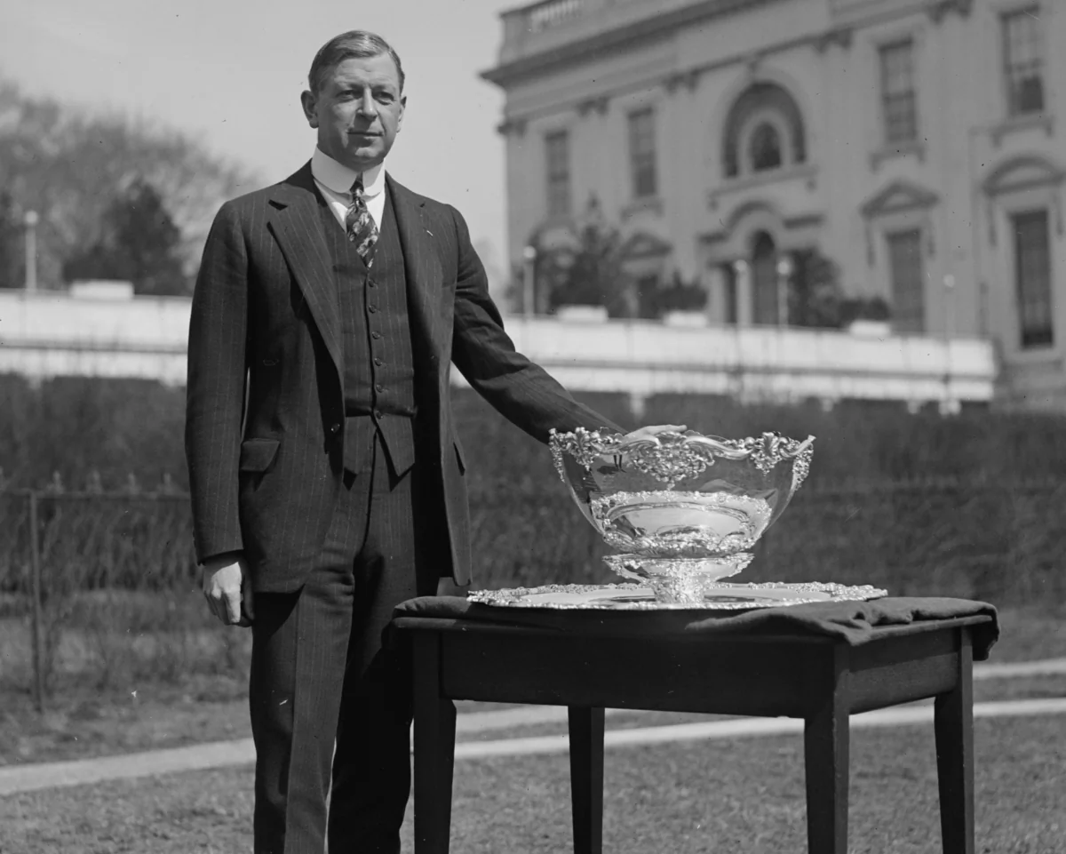 Dwight Davis standing next to the Davis Cup trophy on March 17, 1924. Library of Congress. (Public Domain)