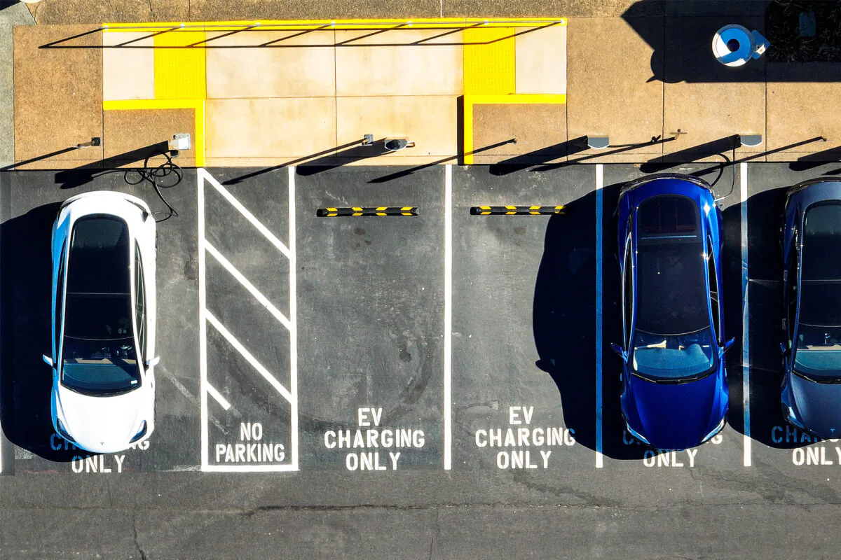 Tesla electric vehicles recharge at a Tesla charging station in Corte Madera, Calif., on Feb. 15, 2023. (Justin Sullivan/Getty Images)