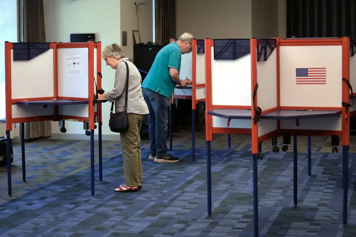 Voters fill out their ballots at the Newton Free Library in Newton, Mass., on Sept. 3, 2024. (Steven Senne/AP Photo)