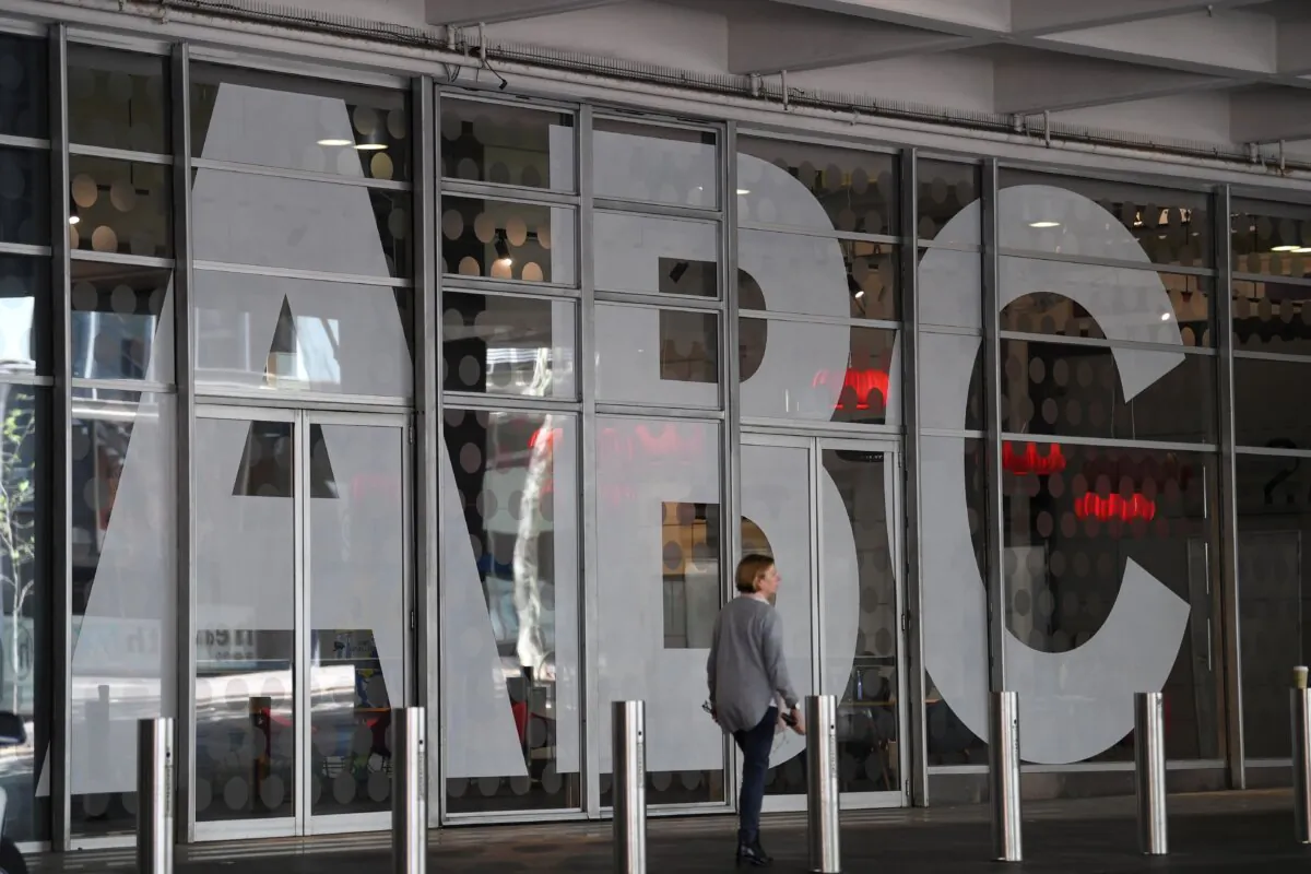 A woman walks past Australia's public broadcaster ABC's head office building in Sydney, Australia, on Sept. 27, 2018. (Saeed Khan/AFP via Getty Images)