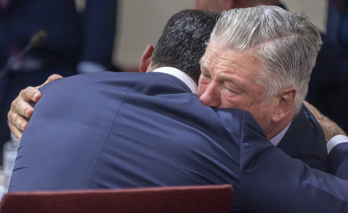 Actor Alec Baldwin (R) hugs his defense attorney Alex Spiro after District Court Judge Mary Marlowe Sommer threw out the involuntary manslaughter case in Santa Fe, N.M., on July 12, 2024. (Luis Sánchez Saturno/Santa Fe New Mexican via AP, Pool)