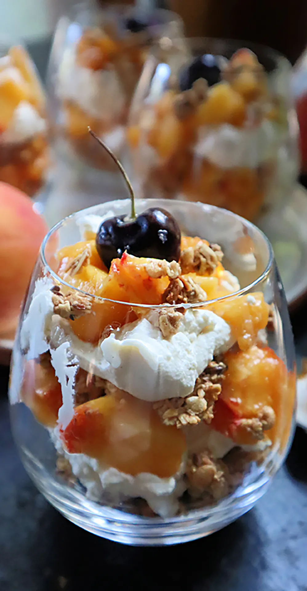 Individual peach parfaits layered with homemade granola and with spiced whipped cream are a crowd-pleasing Labor Day dessert. (Gretchen McKay/Post-Gazette)