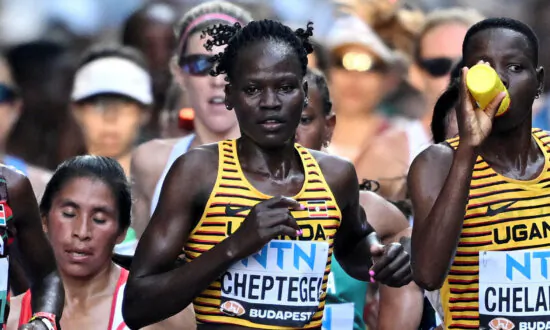 Alleged Killer of Ugandan Olympian Dies From Burns, Hospital Says
