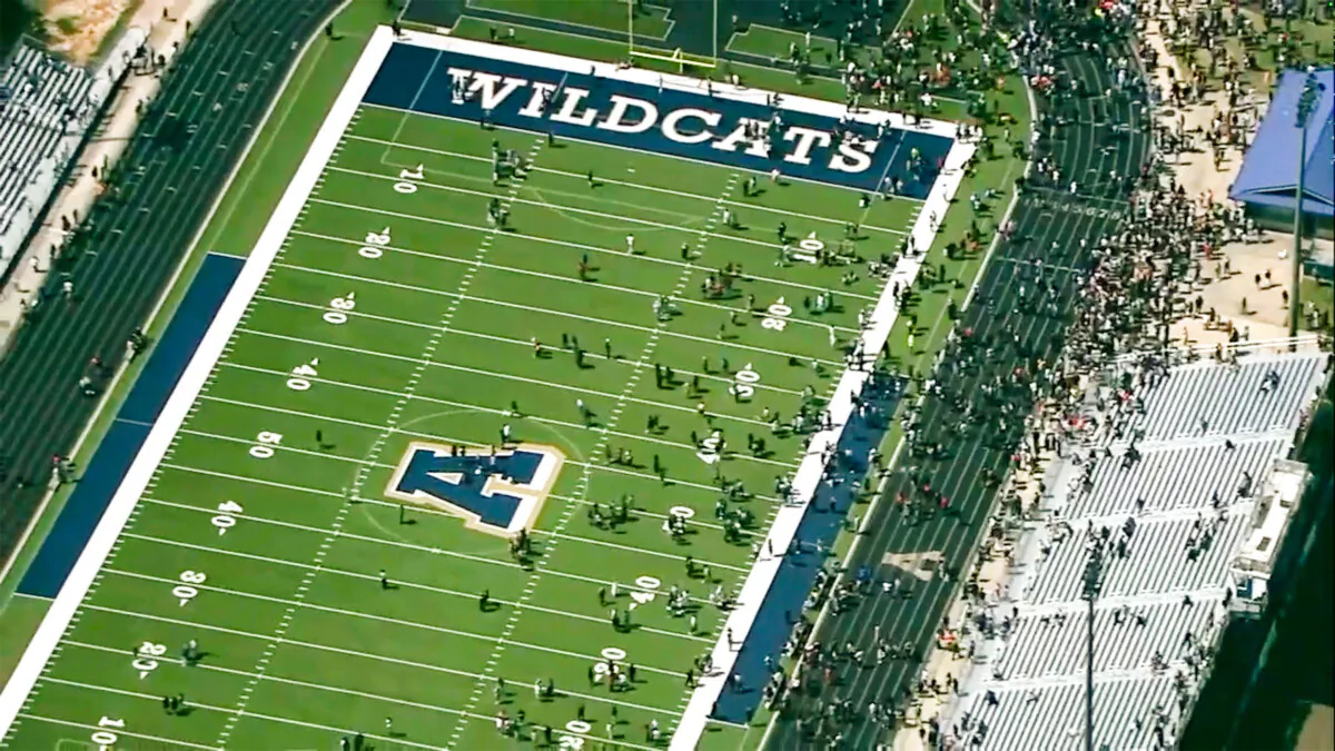 Students are evacuated to the football stadium after the school campus was placed on lockdown, at Apalachee High School in Winder, Ga., on Sept. 4, 2024. (WSB via AP)