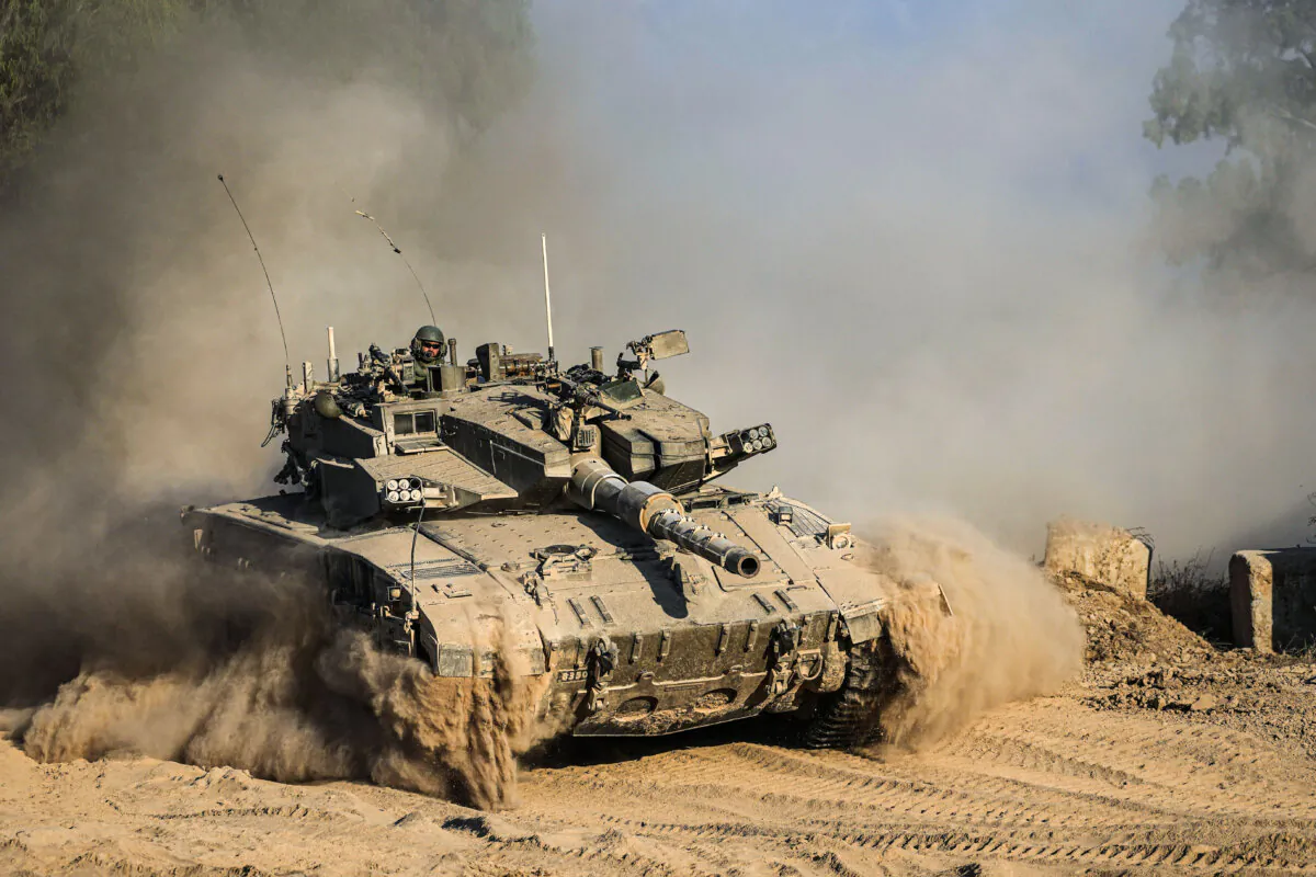 An Israeli tank near the Israel–Gaza border, as seen from southern Israel, on July 14, 2024. (Tsafrir Abayov/AP Photo)