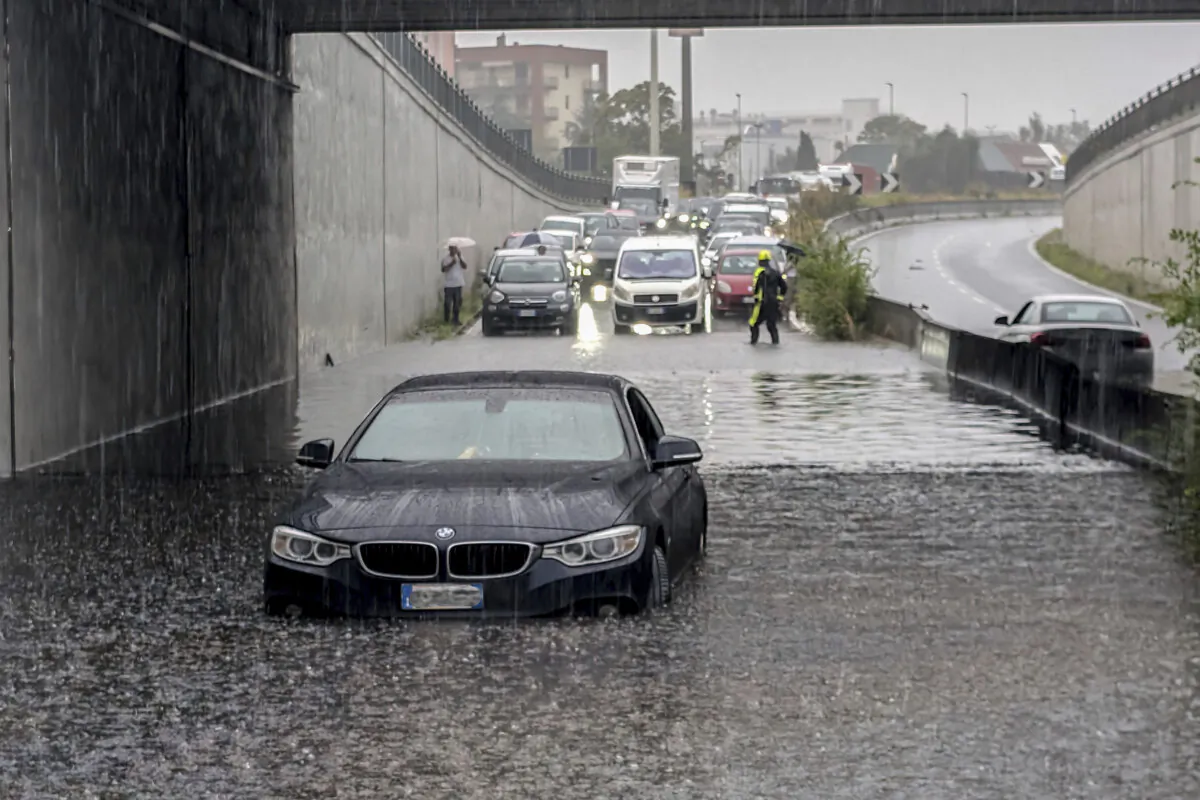 Cars are blocked in flooded streets in Milan, northern Italy, Thursday, Sept. 5, 2024. (Claudio Furlan/LaPresse via AP)