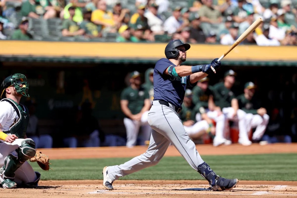 Cal Raleigh of the Seattle Mariners watches the flight of his two-run, first-inning home run against the Oakland A's in Oakland, Calif., on Sept. 5, 2024. (Jed Jacobsohn/AP Photo)