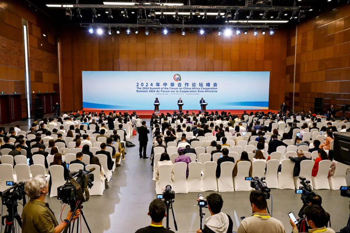 China's Foreign Minister Wang Yi addresses a press conference as his counterparts look on during the Forum on China-Africa Cooperation (FOCAC) in Beijing on Sept. 5, 2024. (Greg Baker/AFP via Getty Images)