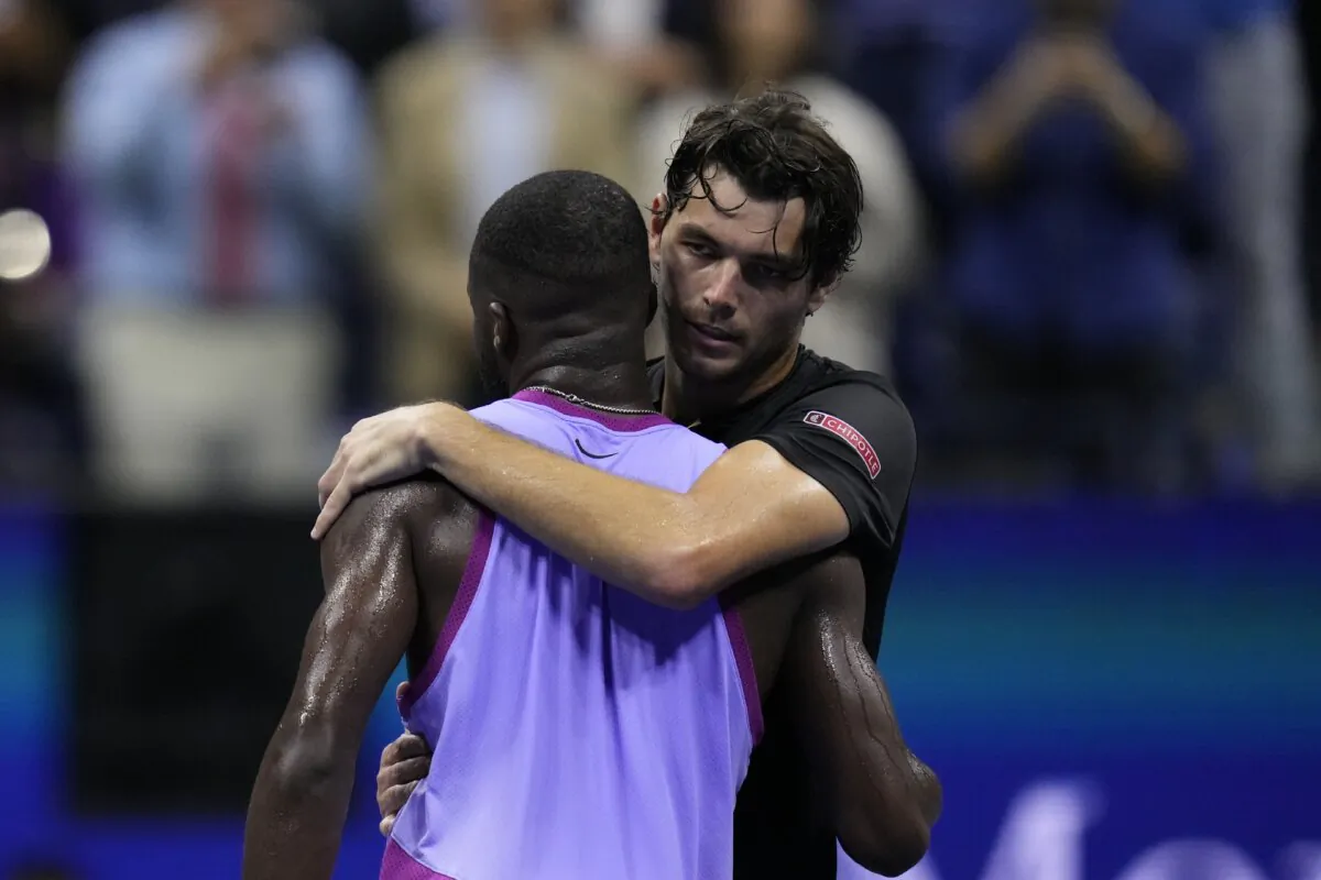 Taylor Fritz, of the United States, hugs Frances Tiafoe, of the United States, after winning the men's singles semifinals of the U.S. Open tennis championships, Friday, Sept. 6, 2024, in New York. (Kirsty Wigglesworth/AP Photo)