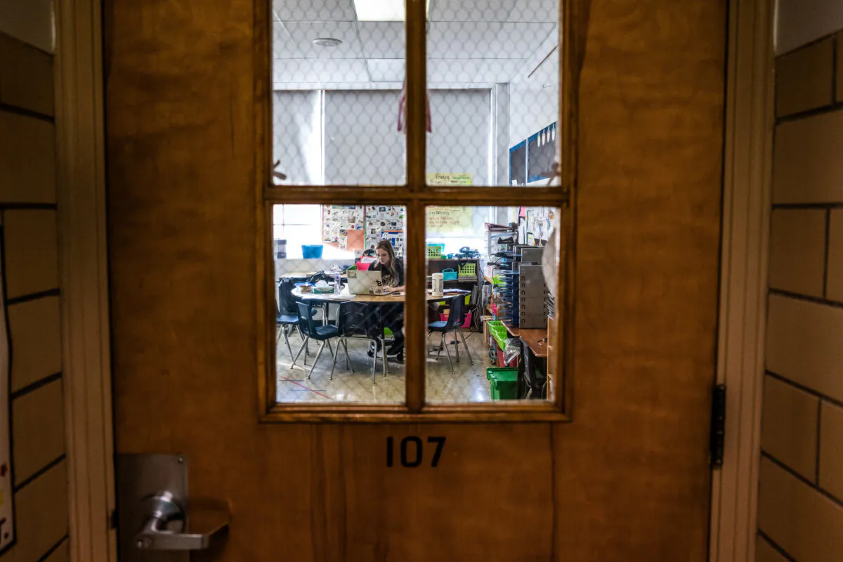 A teacher works in a classroom at Hazelwood Elementary School in Louisville, Ky., on Jan. 11, 2022. (Jon Cherry/Getty Images)